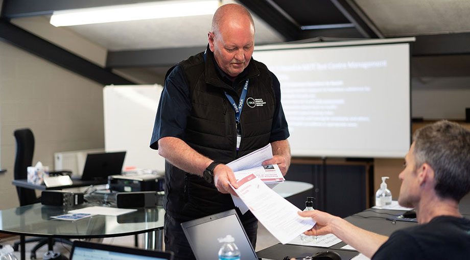 MOT Management Training Level 3 - Lee Holt handing paper